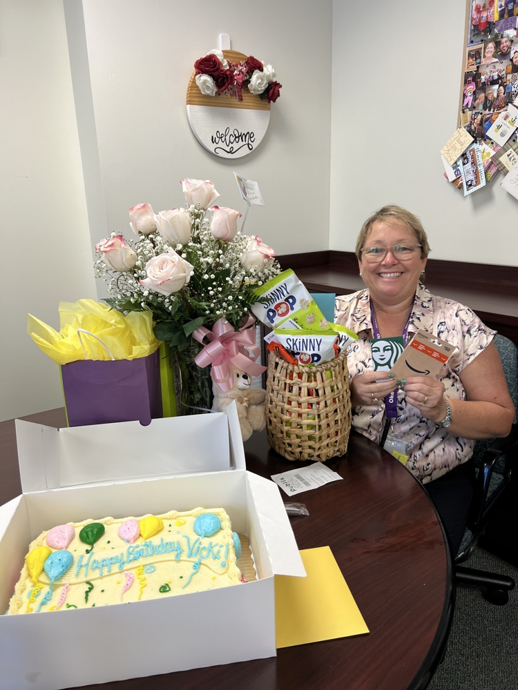principal with gifts for birthday 