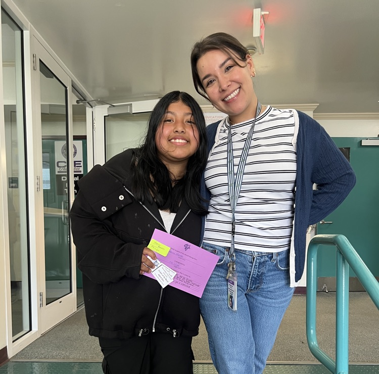 teacher and student in hallway