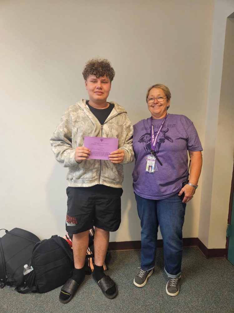 student with principal holding certificate 