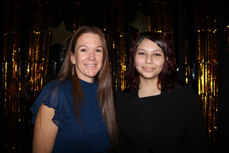 teacher with student at banquet
