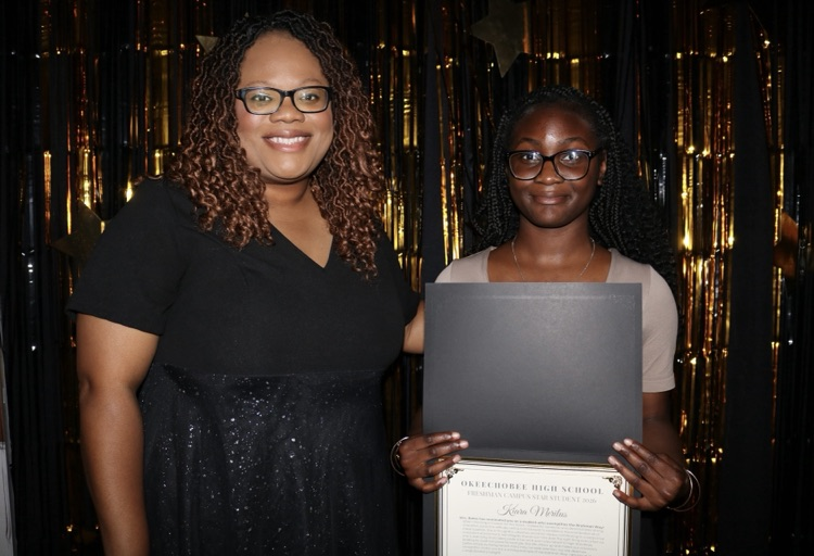 principal and student at banquet