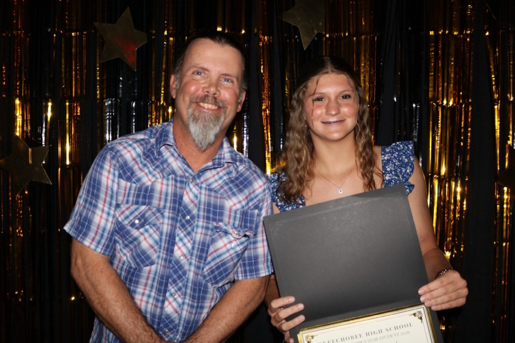 teacher and student at banquet