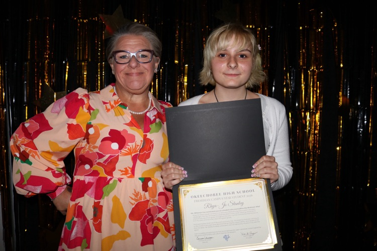 teacher and student at banquet