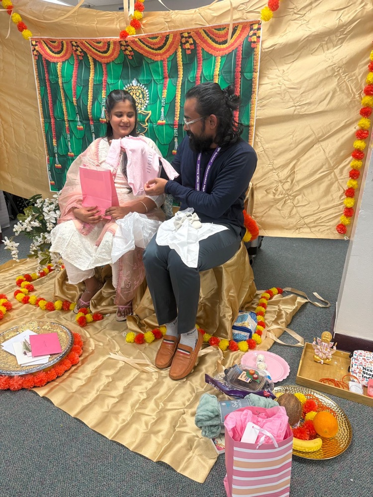two people looking at babyshower gifts 