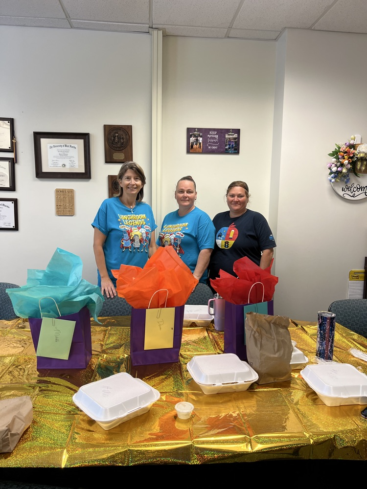 three school lunch ladies being celebrated 
