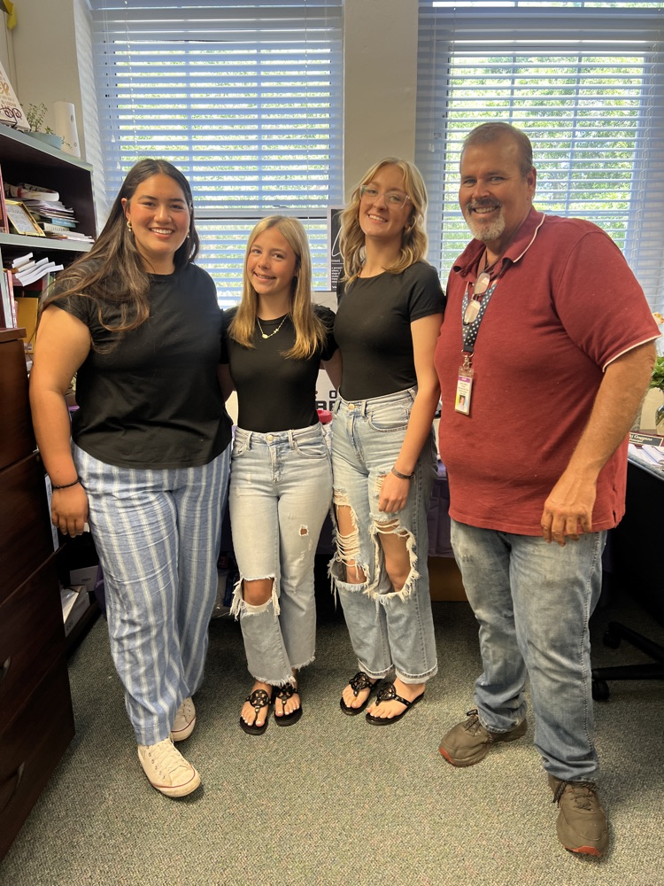 three students and ag teacher 