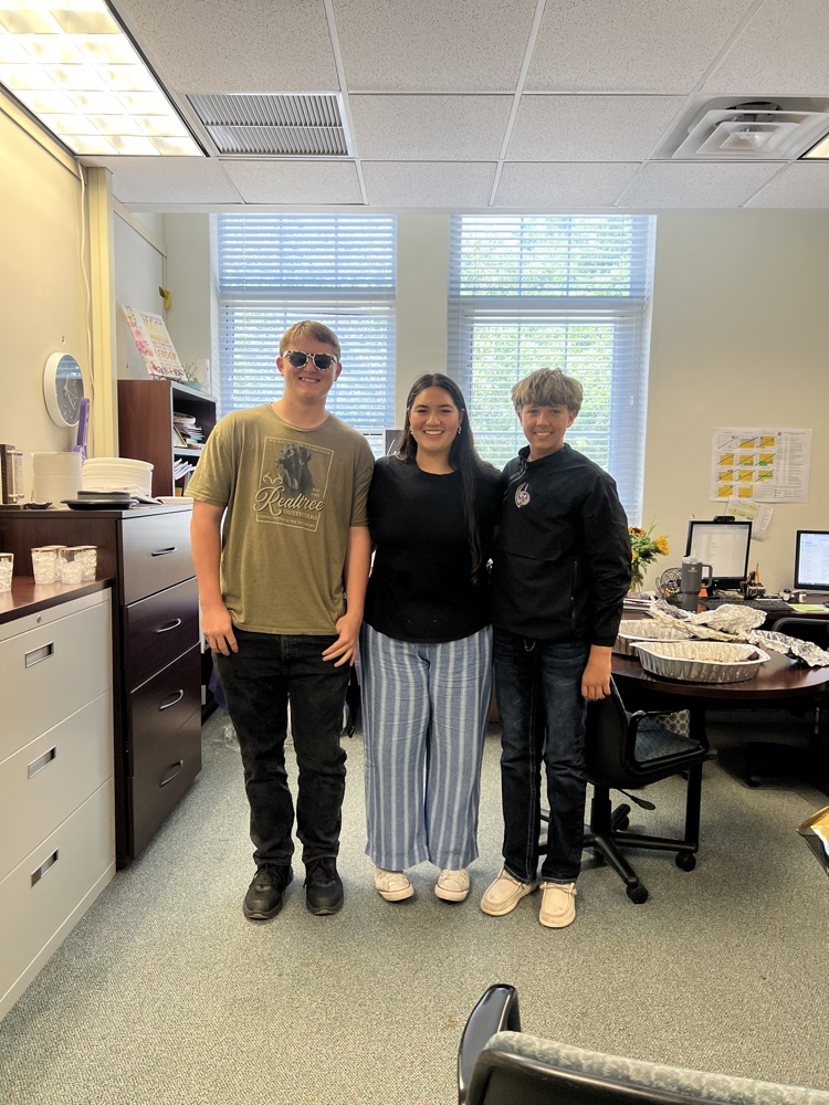 three students in principals office 