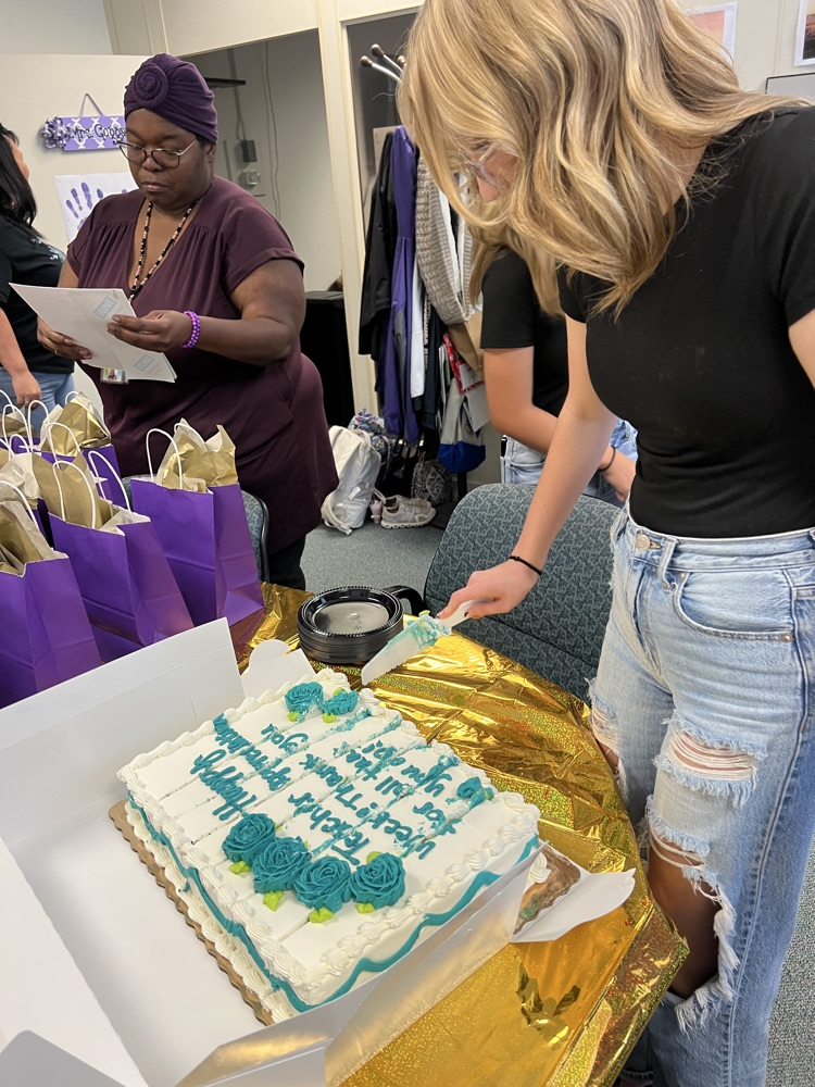 student cutting cake 