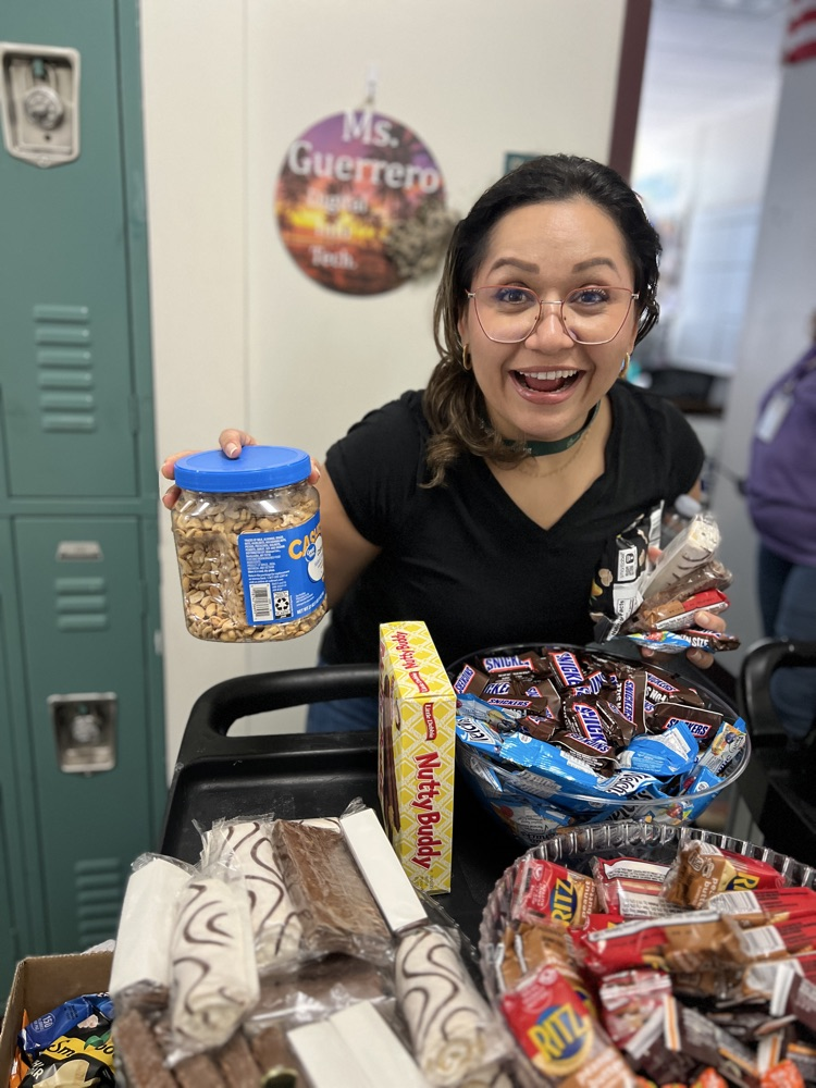teacher grabbing snacks from cart