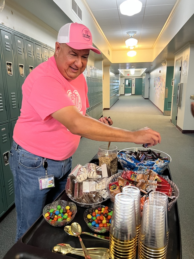 teacher grabbing snacks from cart