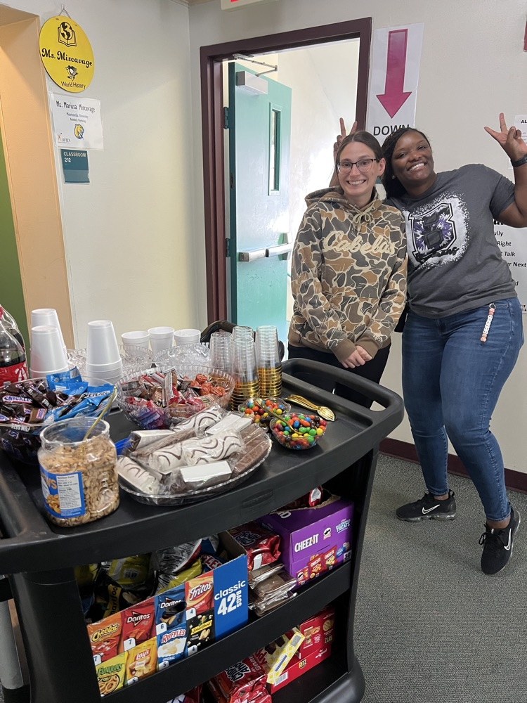 teacher grabbing snacks from cart