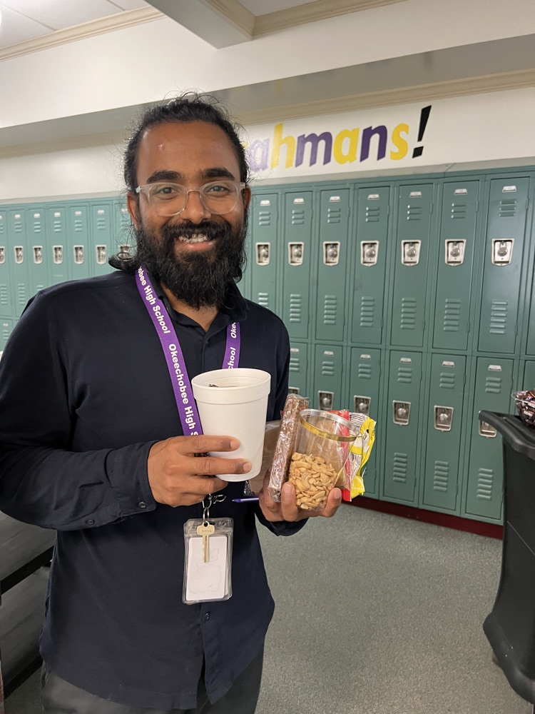 teacher grabbing snacks from cart