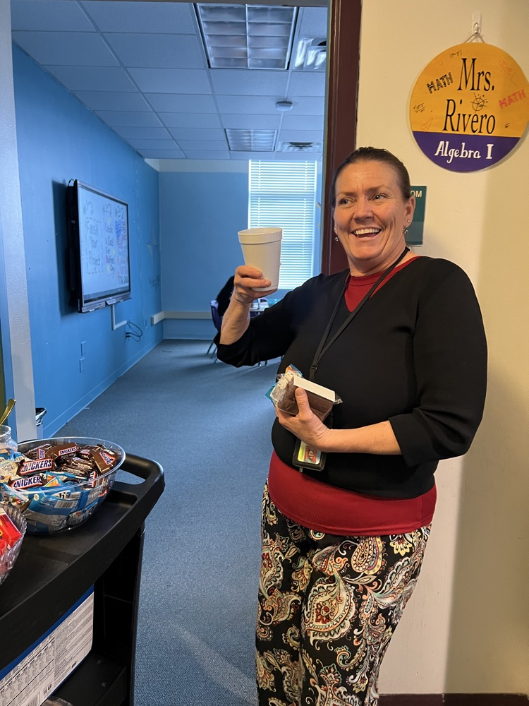 teacher grabbing snacks from cart