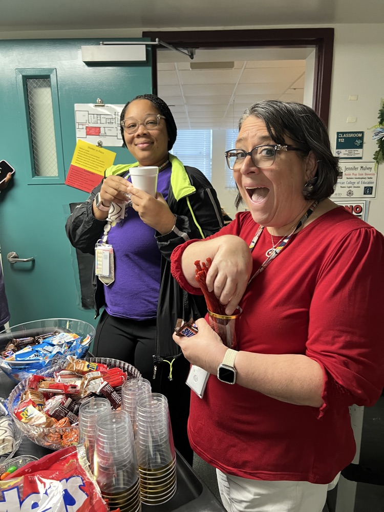 teachers grabbing snacks from cart