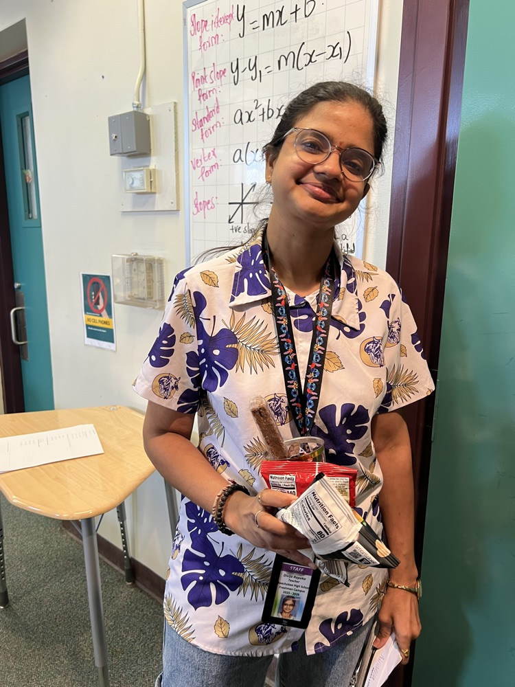 teacher grabbing snacks from cart