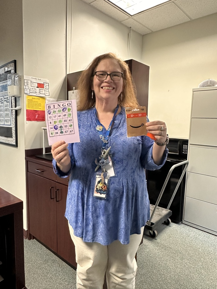 teacher holding gift card 