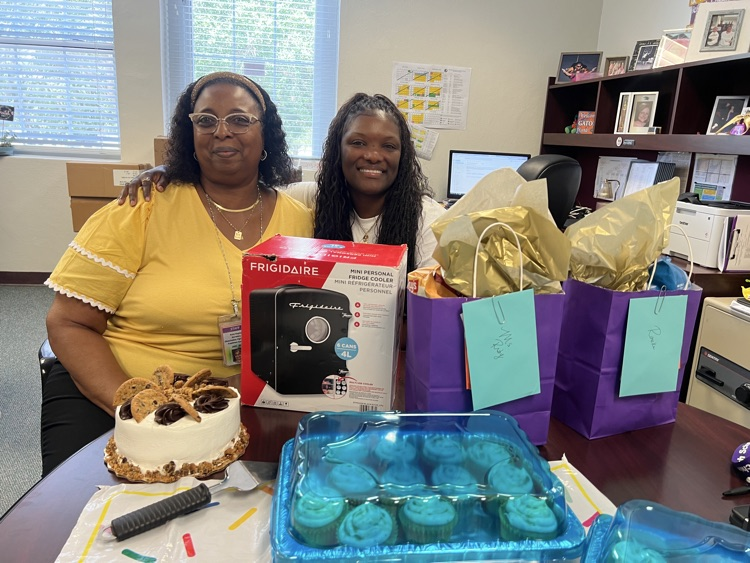 two staff members celebrating birthday in principals office