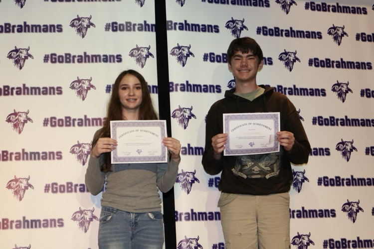 students with certificates on stage