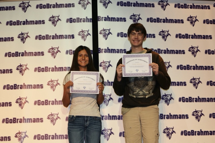 students with certificates on stage