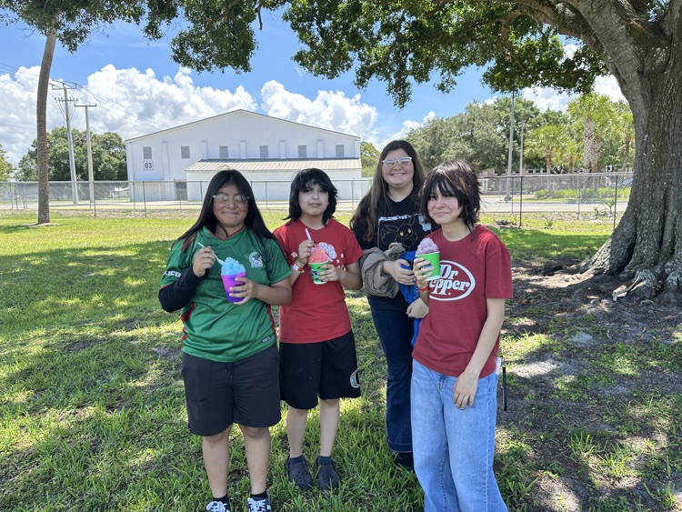 four students with Kona Ice