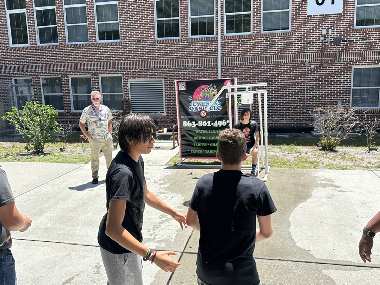 students playing games in school courtyard