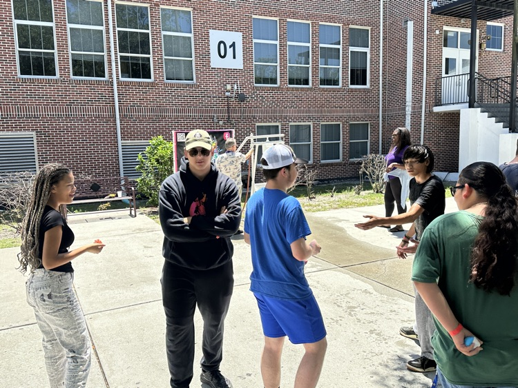 students playing games in school courtyard