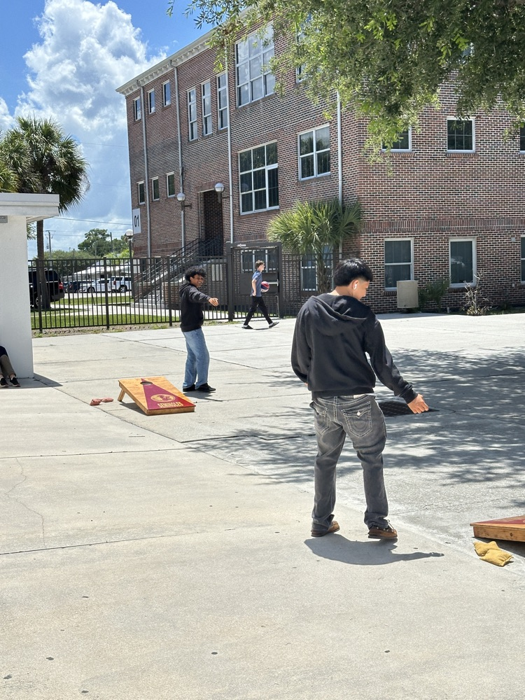 students playing games in school courtyard