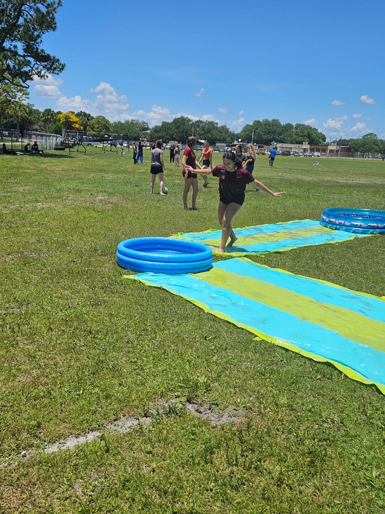 students playing on water slide