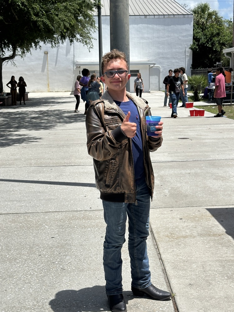 student holding Kona ice