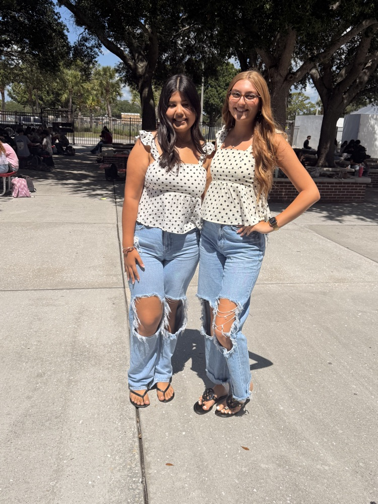 two girls matching in courtyard