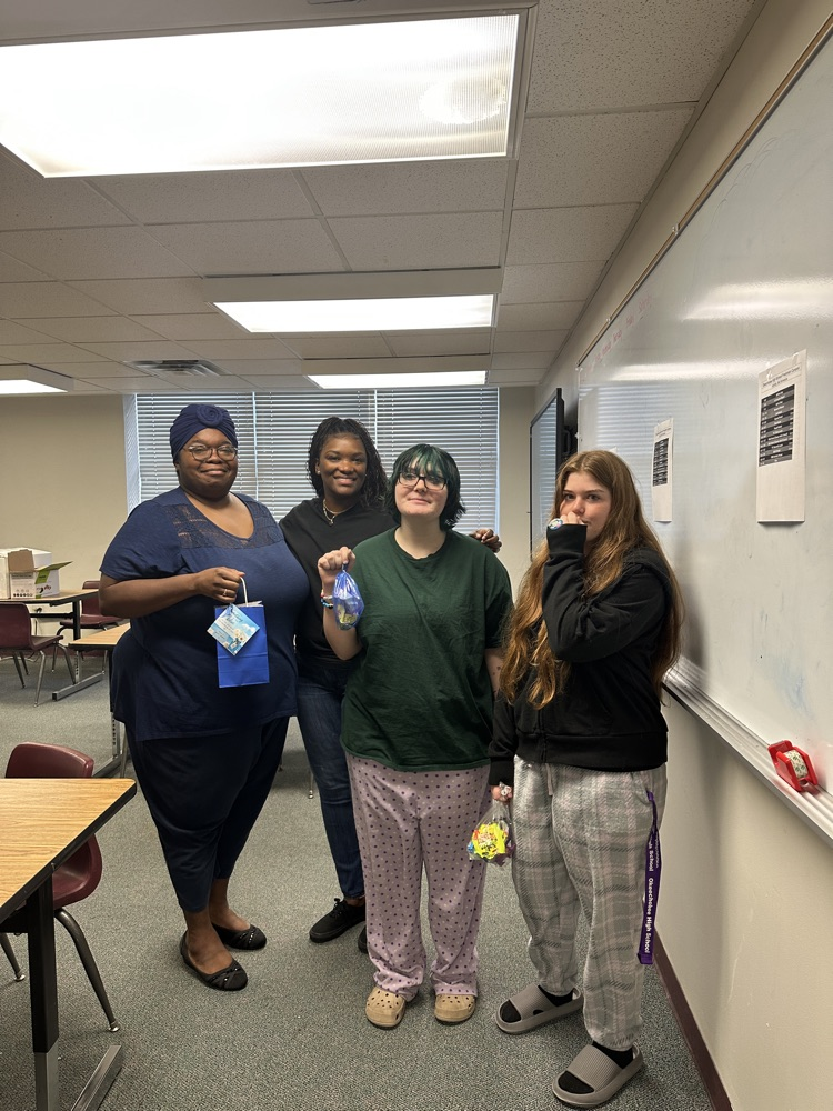 students with teacher getting goody bags