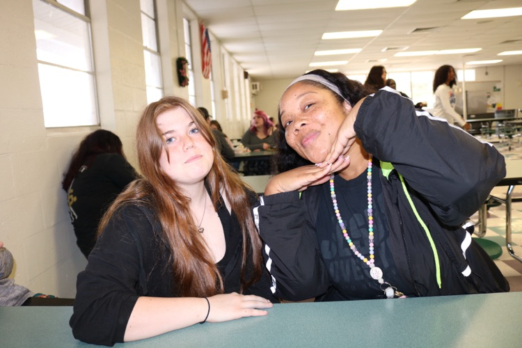 teacher and student in school cafeteria
