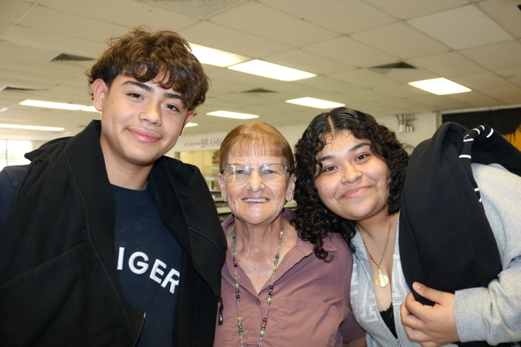 school member and two students in cafeteria