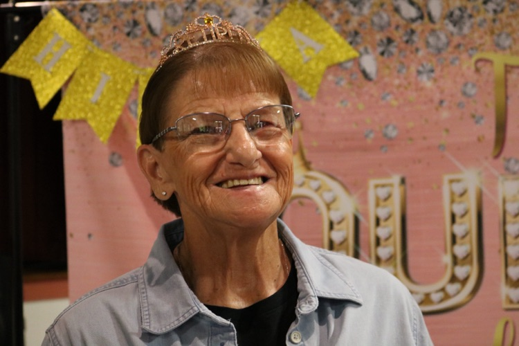 school member with crown on