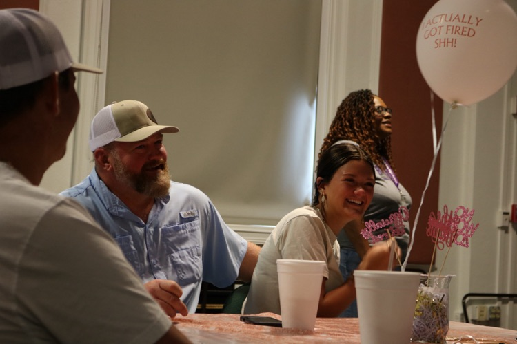 people smiling at retirement party 