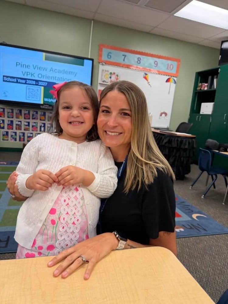 student and teacher at open house