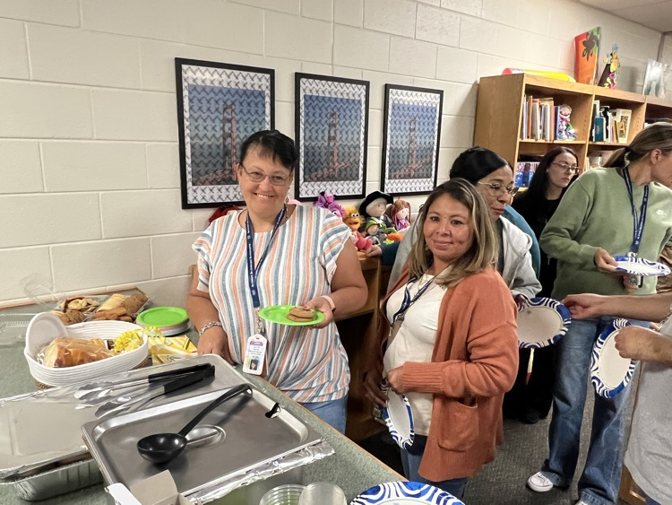 teachers grabbing food in media center