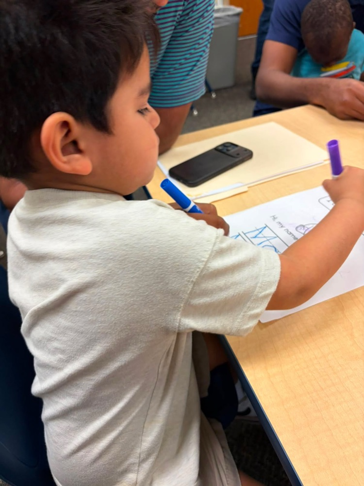 student writing on paper