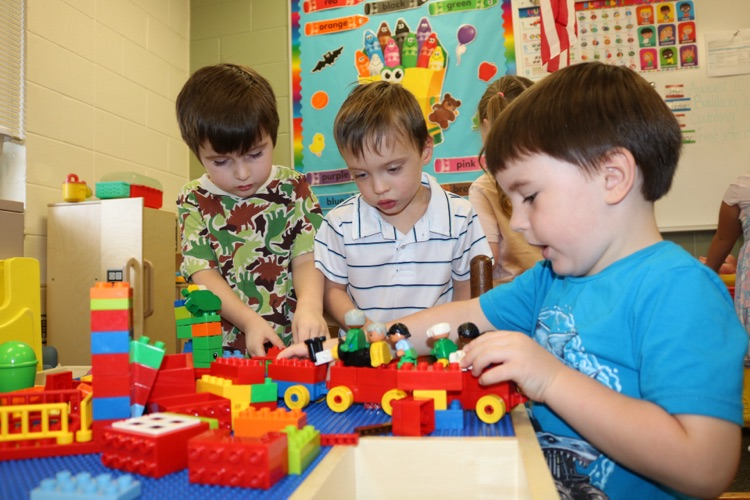 students playing legos