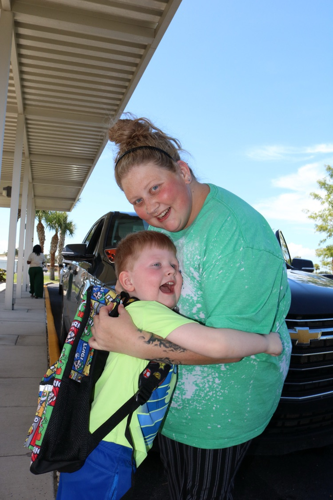 student and mom at drop off
