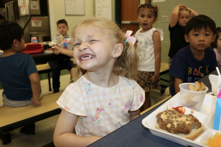vpk student in cafe smiling