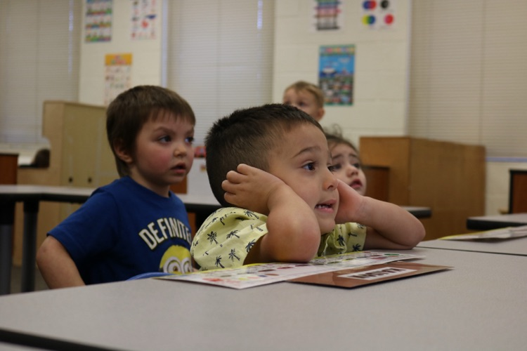 vpk students sitting and looking at board