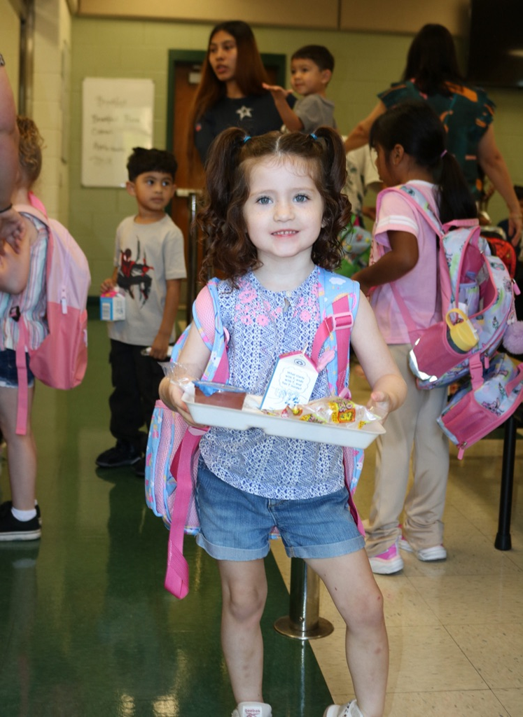 prek student getting breakfast
