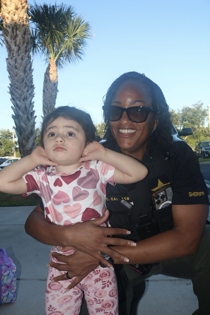 prek student with SRO hugging her