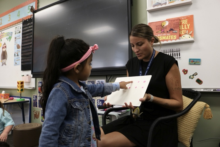 student and teacher in class