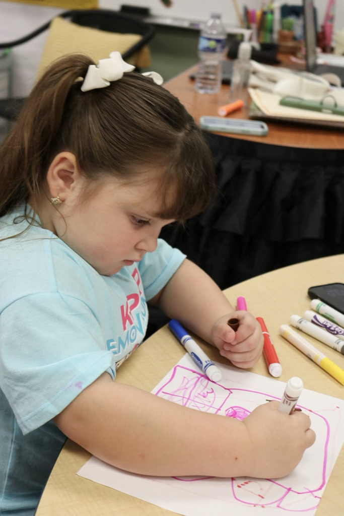 student writing on paper