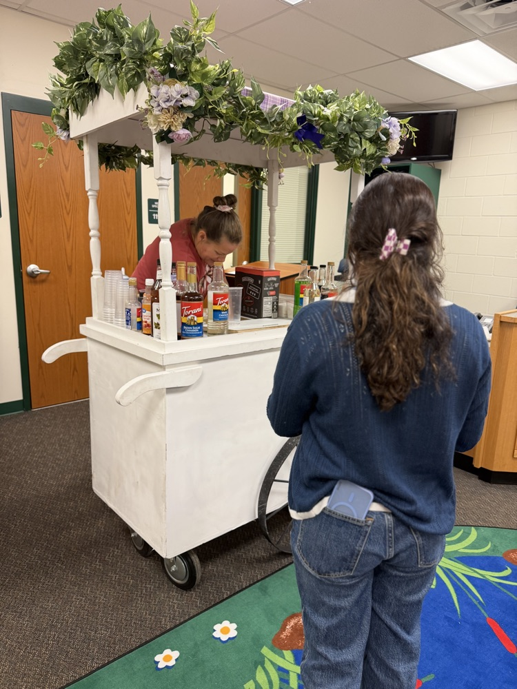 staff waiting on coffee cart