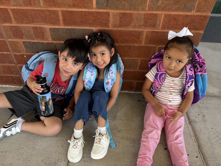three prek students sitting on the floor 
