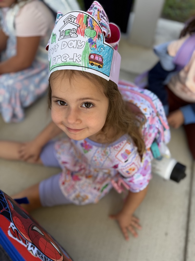 vpk student sitting on floor