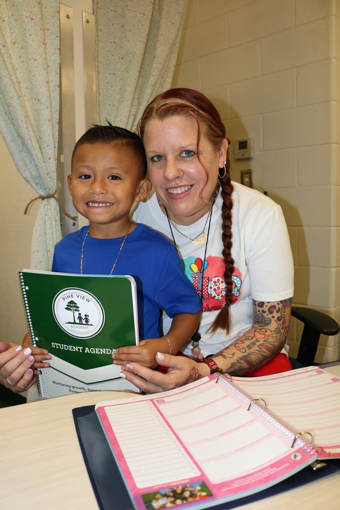 student and teacher showing agenda